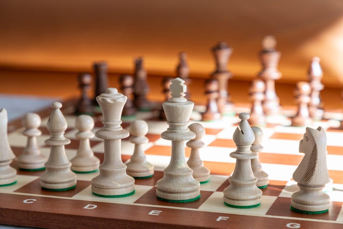 Close-up of chess pieces showing surface finish and the detail on a knight