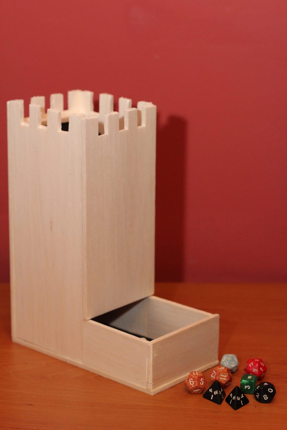 A hand-built dice tower with internal ramps and a catch tray