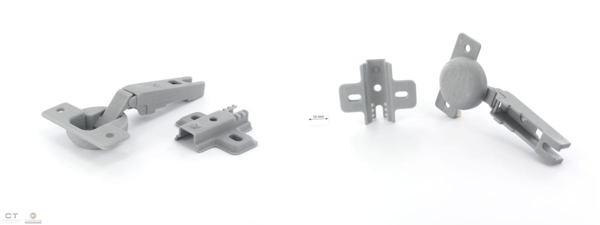 A grey 3D printed concealed cabinet hinge and its separate mounting plate, photographed from two angles against a white background with a 10mm scale bar between them