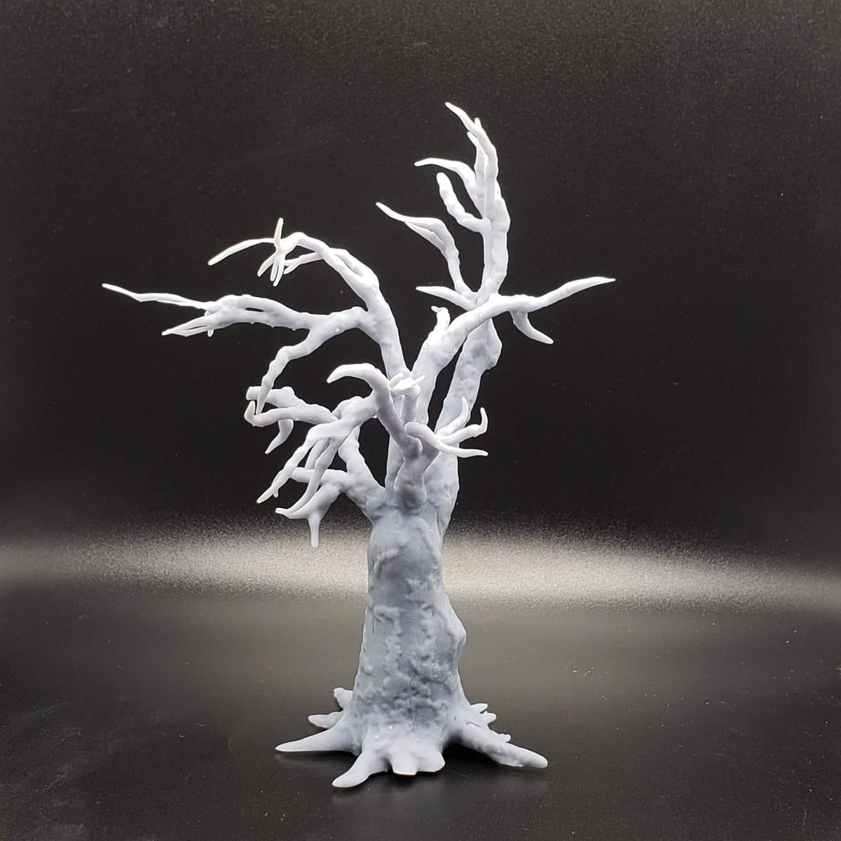 An unpainted white 3D printed bare tree model against a black background