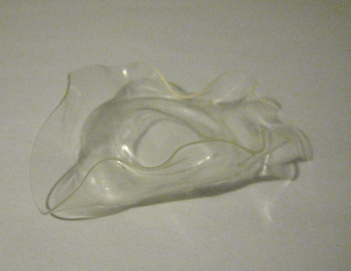 A PLA plastic cup deformed and slumped by heat
