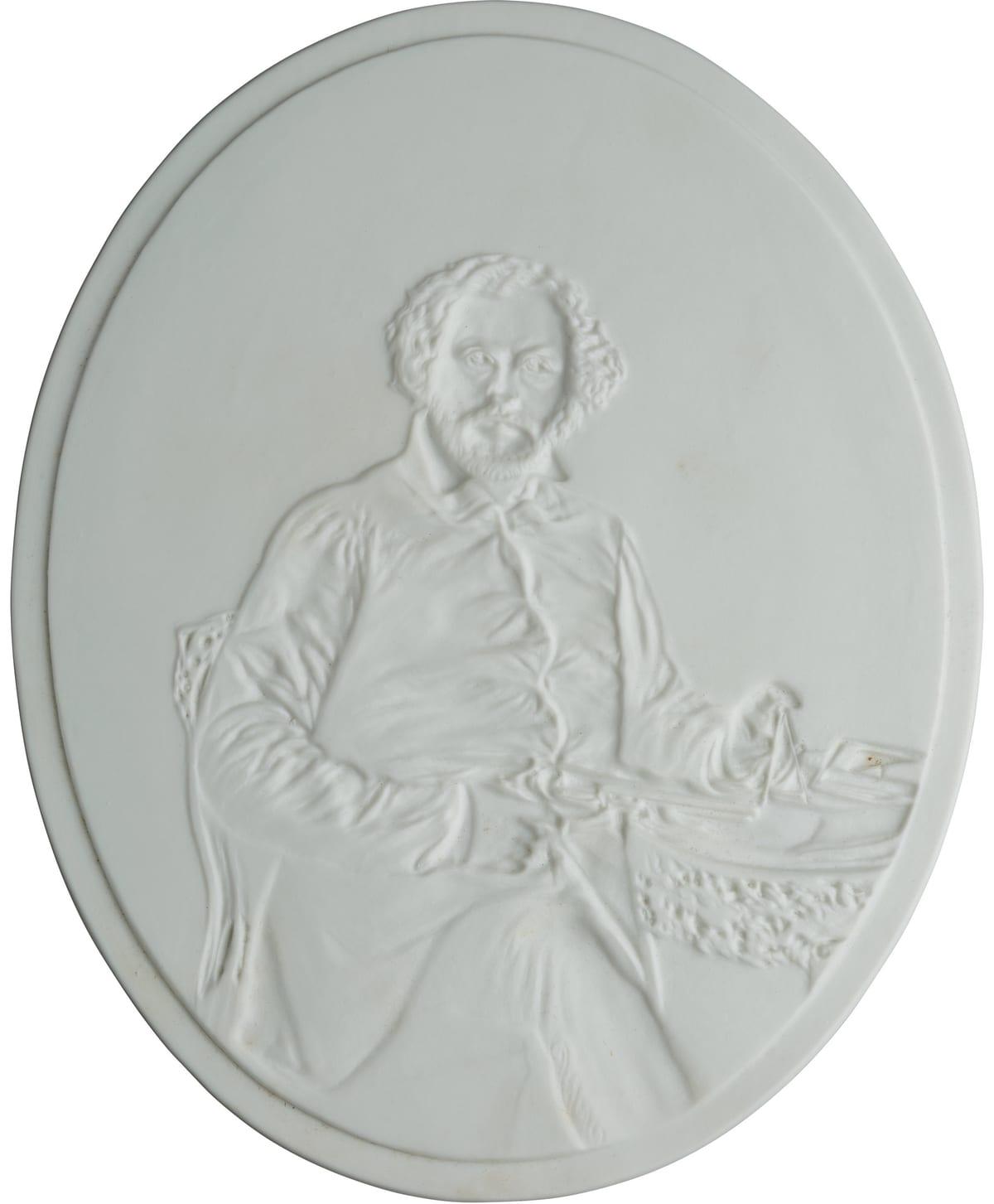 An oval white porcelain lithophane plaque photographed in ordinary room light, showing only shallow surface relief and no tonal image