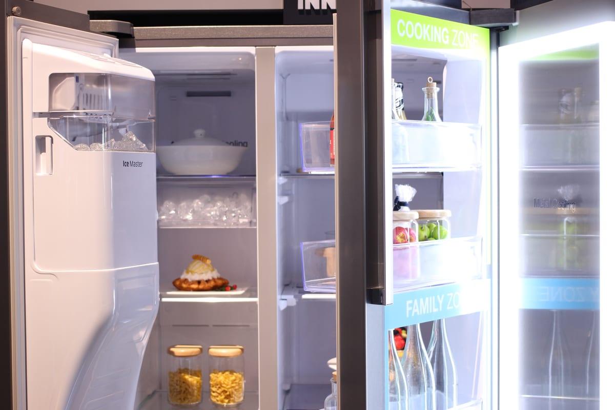 An open refrigerator showing transparent door bins mounted on the inside of the door